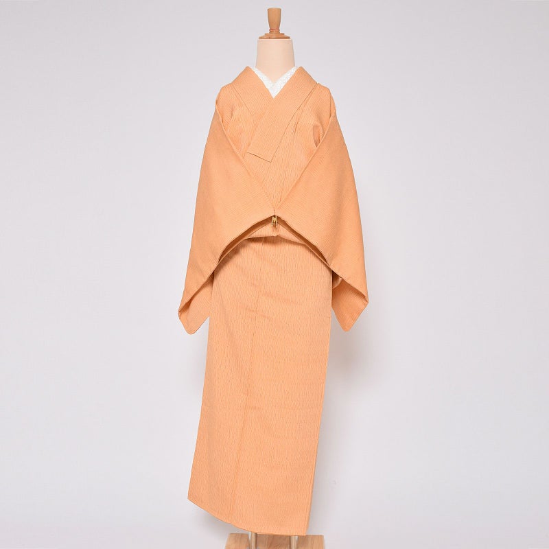 【中古品】仕立て上がり 袷着物 「縮緬　明るいオレンジによろけ縞」 小紋 正絹